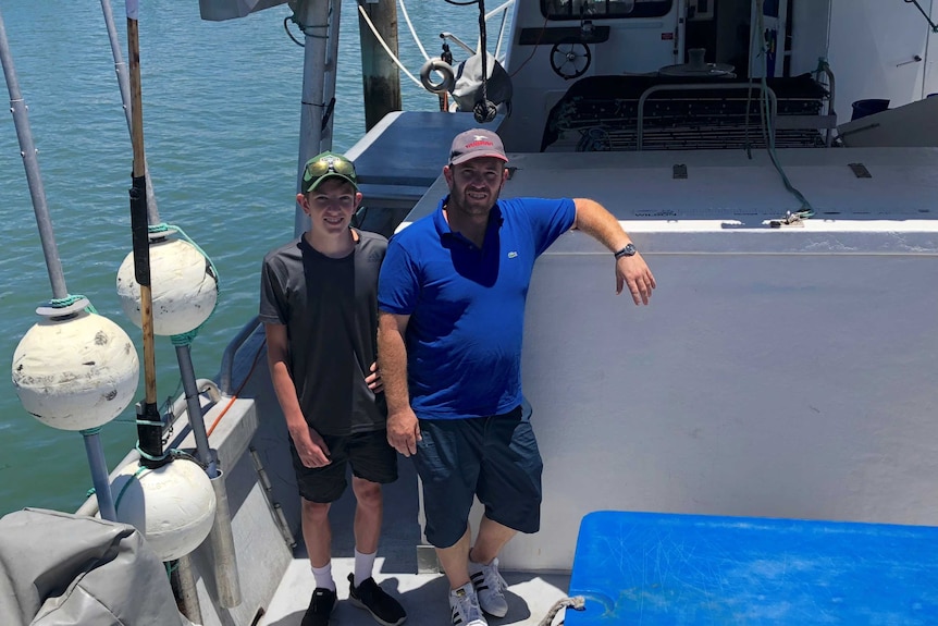 Father and son, Peter and George Rockliff on board their boat Barameda-K.