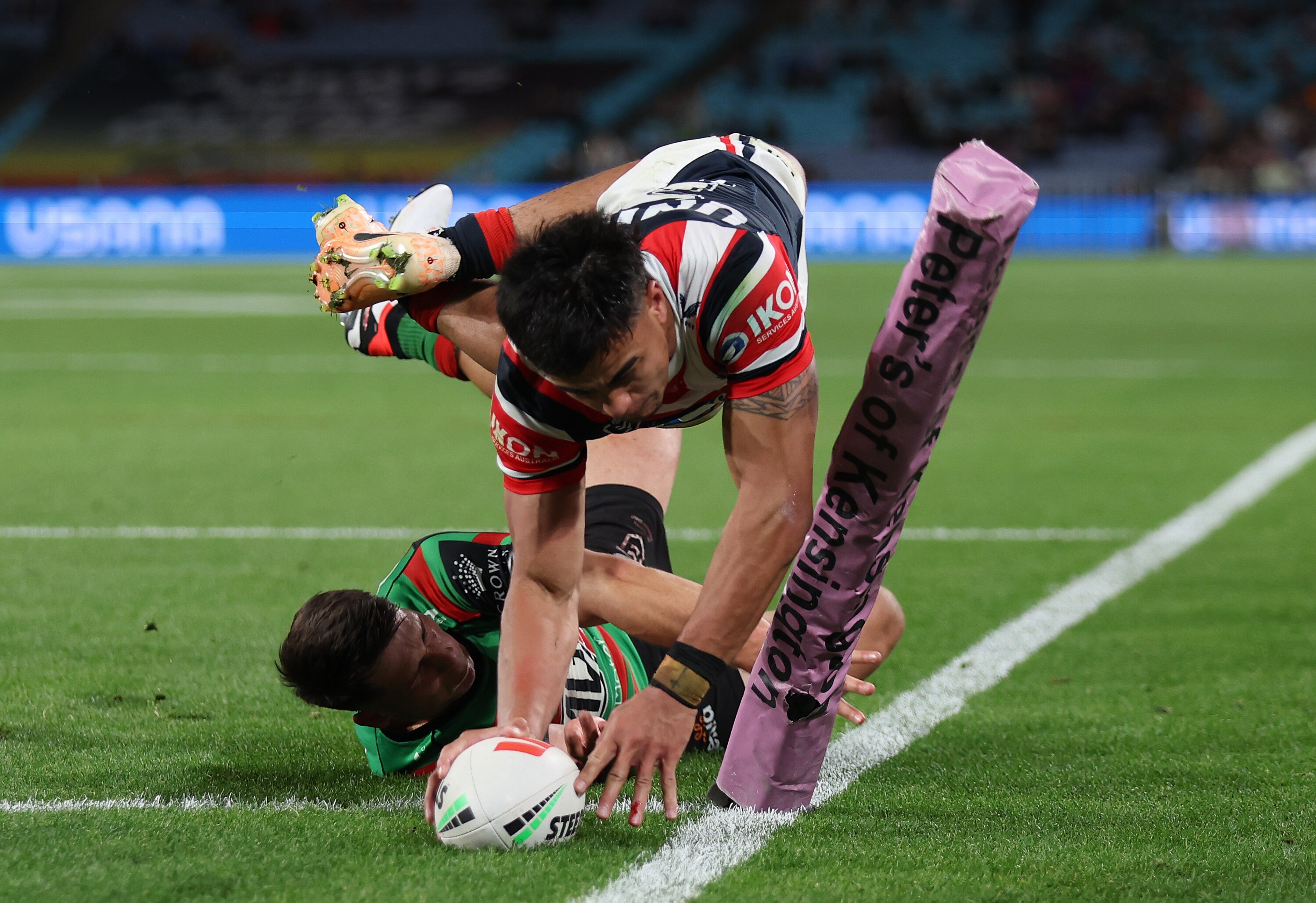 A man scores a try in a rugby league match