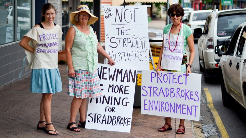 Amanda Brigden, Liz Johnston and Jan Aldenhoven protest in Ashgrove against LNP plans to continue mining on Stradbroke Island.