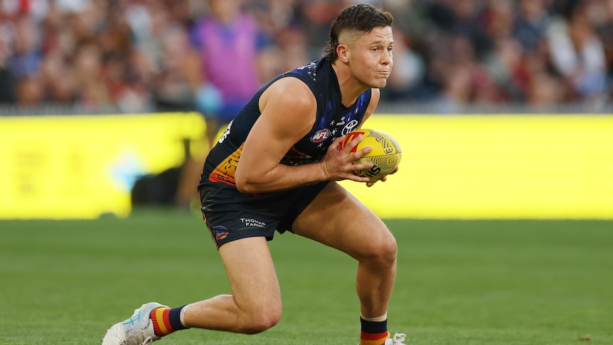 Jake Soligo marks for the Crows against the Eagles.