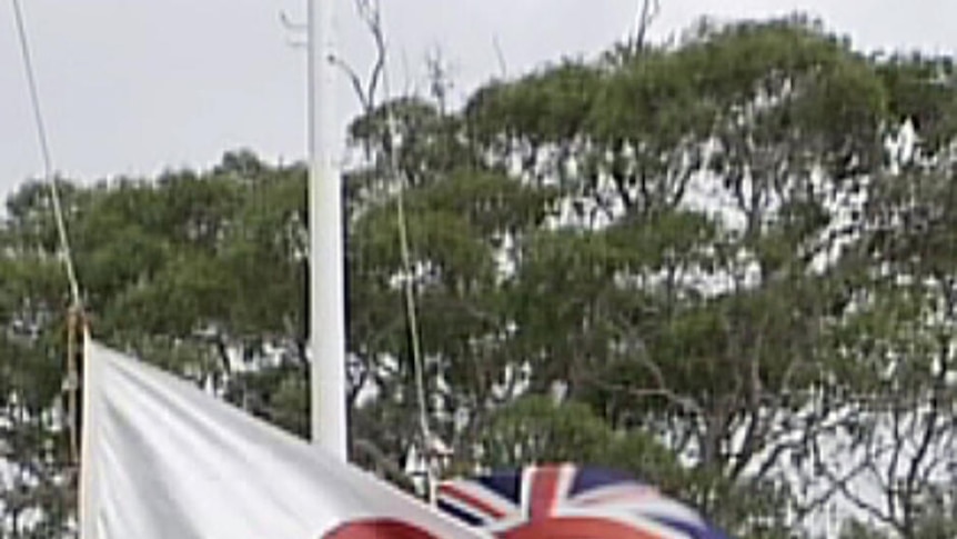 Japan Australian flags at half mast