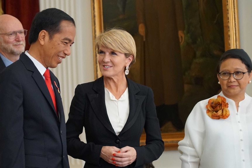 Julie Bishop talks to Joko Widodo as Retno Marsudi watches on.