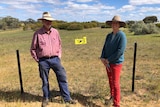 Phil and Fiona Murdoch stand near the electric fence that was installed on their property back in 2014. 
