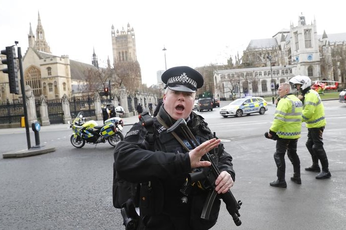 Armed police respond outside the attack on Westminster Bridge in London on March 22, 2017.