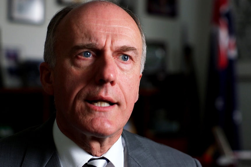 A close-up of Eric Abetz in an office setting