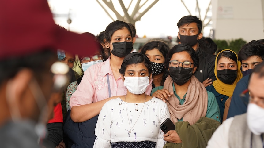 A group of young Indians together in an airport 