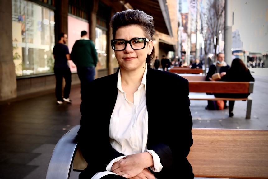 Woman sits on bench