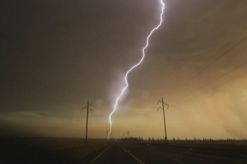 Justin captured lightening bisecting power poles in America.