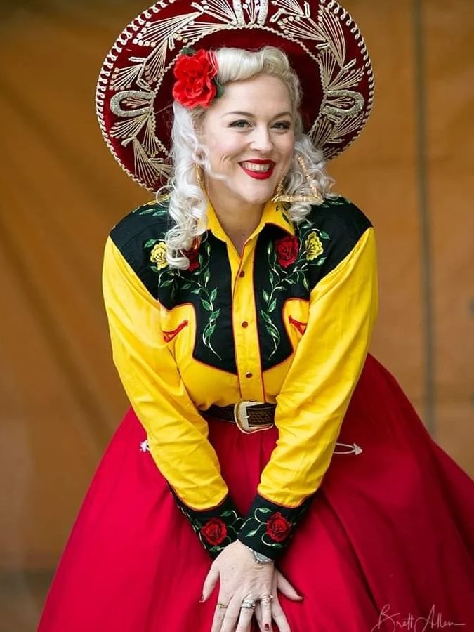 woman in big hat smiling