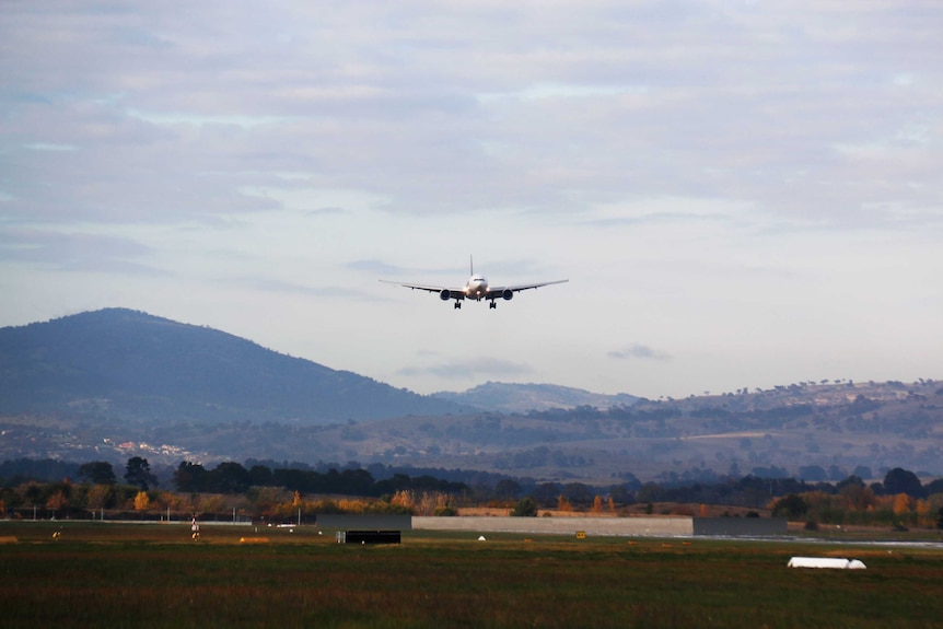 A plane prepares to land at Canberra Airport.