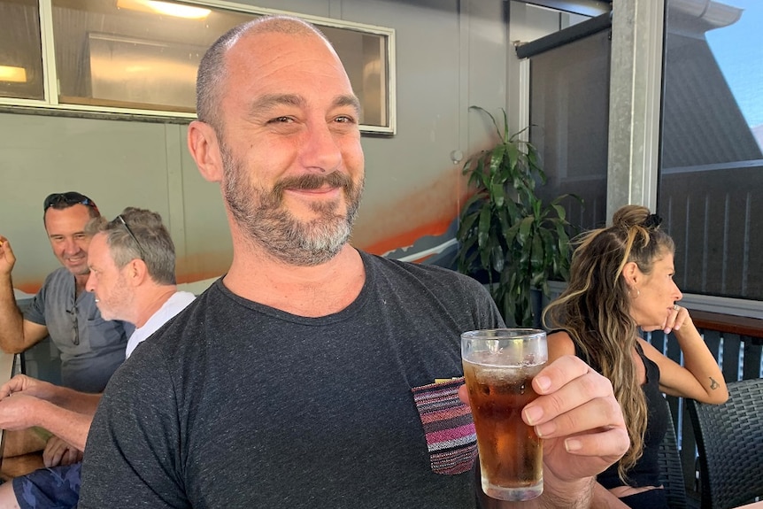 Byron Bay man Luke Jolly enjoys a drink.