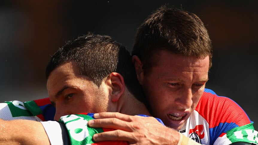 Opening round romp ... the Knights' Kurt Gidley (r) and Jarrod Mullen celebrate another Newcastle try.