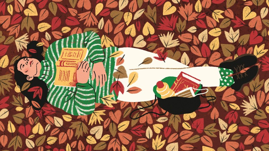 An illustration of a person with long, dark hair lying in autumn leaves, with a yellow book resting open on their chest