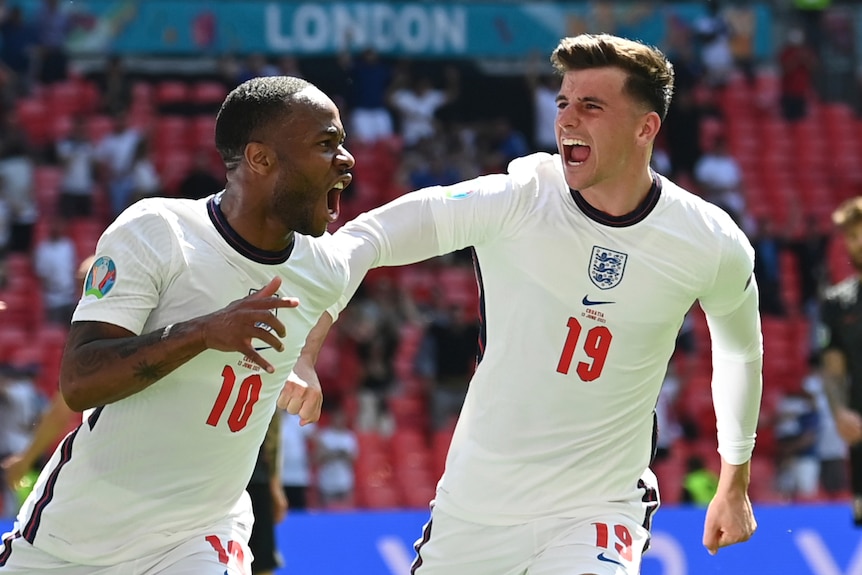 Raheem Sterling shouts with delight as Mason Mount runs in to congratulate his goal