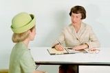 Two women sit in a job interview