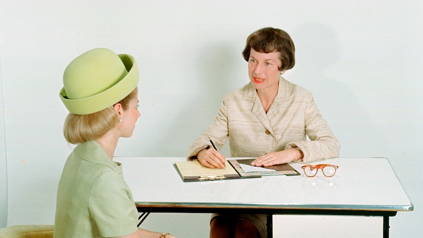 Two women sit in a job interview