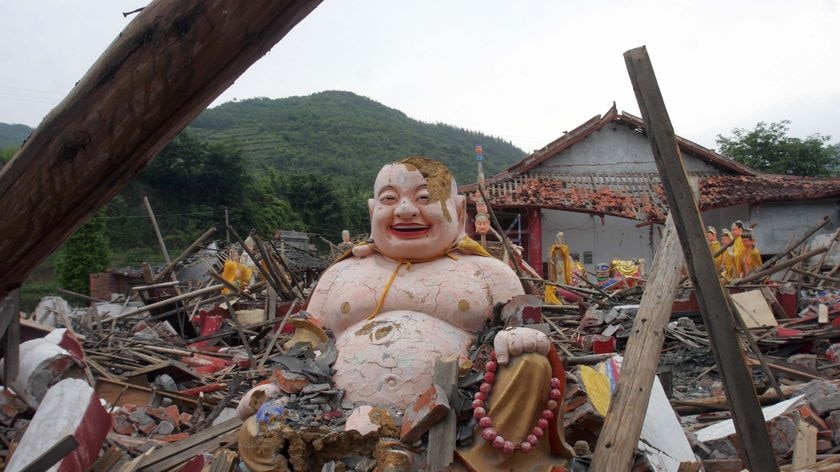Statues of various Chinese deities lay in the rubble of Xiayuan temple in the Sichuan province.