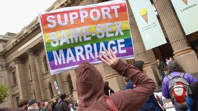 File photo:Protestors in favour of gay marriage rights hold a rally in Melbourne (Getty Images: Luis Ascui)