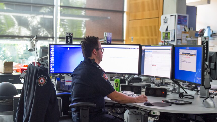 Officers work from various desks within the centre to disseminate information.