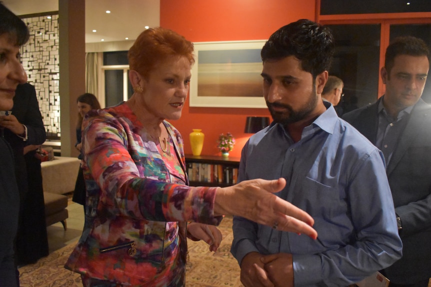 Ishfar Ali talking to Pauline Hanson.