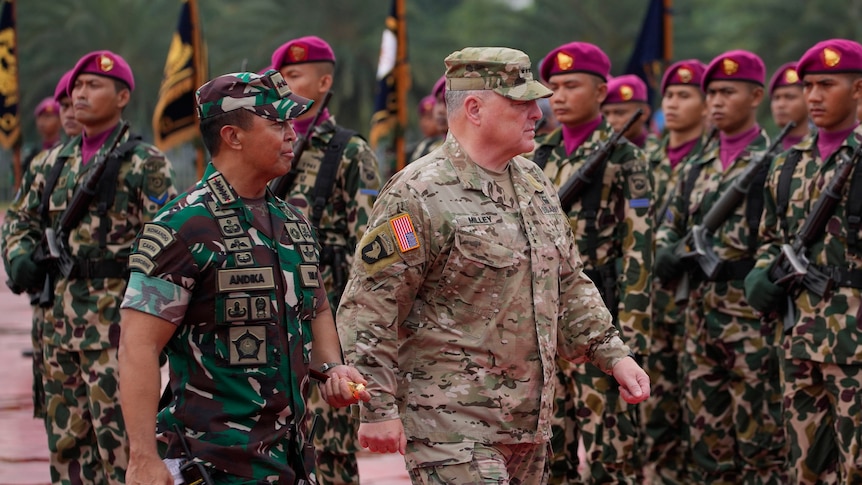 U.S. Chairman of the Joint Chiefs of Staff Gen. Mark Milley, center, and Indonesian Armed Forces Chief Gen. Andika Perkasa,