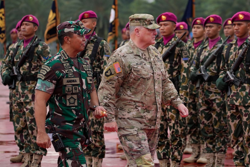 U.S. Chairman of the Joint Chiefs of Staff Gen. Mark Milley, center, and Indonesian Armed Forces Chief Gen. Andika Perkasa,