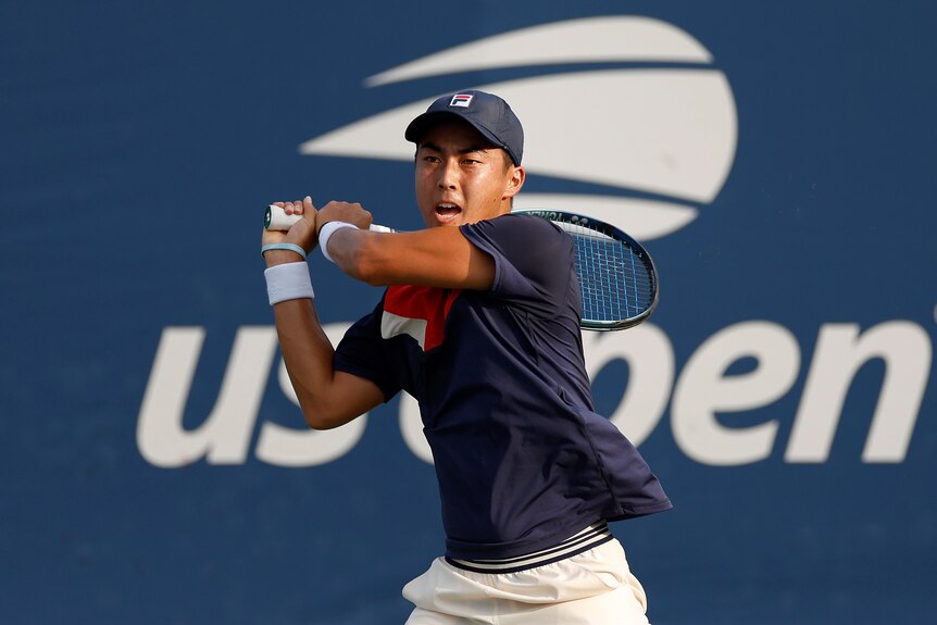 Rinky Hijikata plays a backhand during a US Open match.