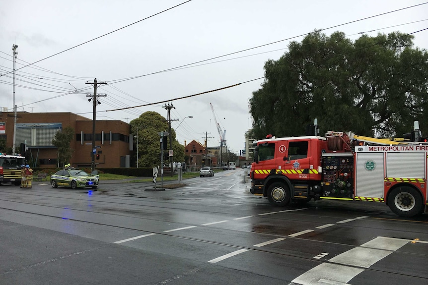 Emergency services block off a road in Moonee Ponds.