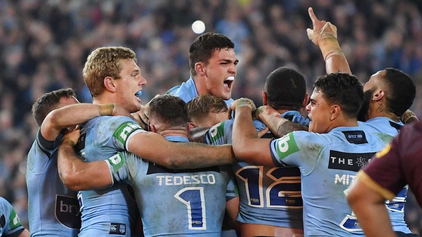 NSW Blues players celebrate winning Game 2 of the 2018 State of Origin series against Queensland.