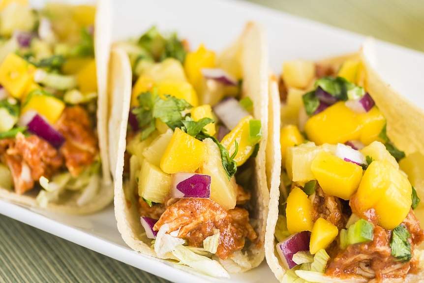 Soft tacos with pineapple chunks