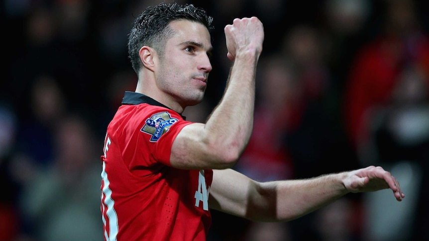 Manchester United's Robin van Persie celebrates after his team beat Arsenal at Old Trafford.