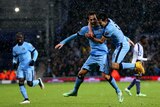 David Silva celebrates with Jesus Navas after scoring for Manchester City against West Brom.