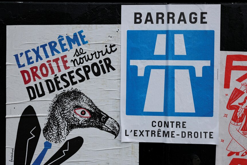 Posters in french plastered to a wall 