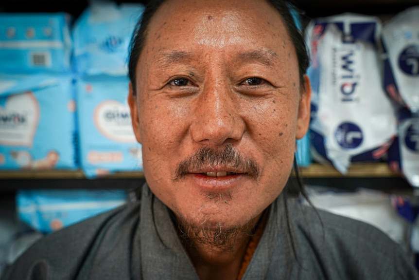A close up of a Bhutanese man's face