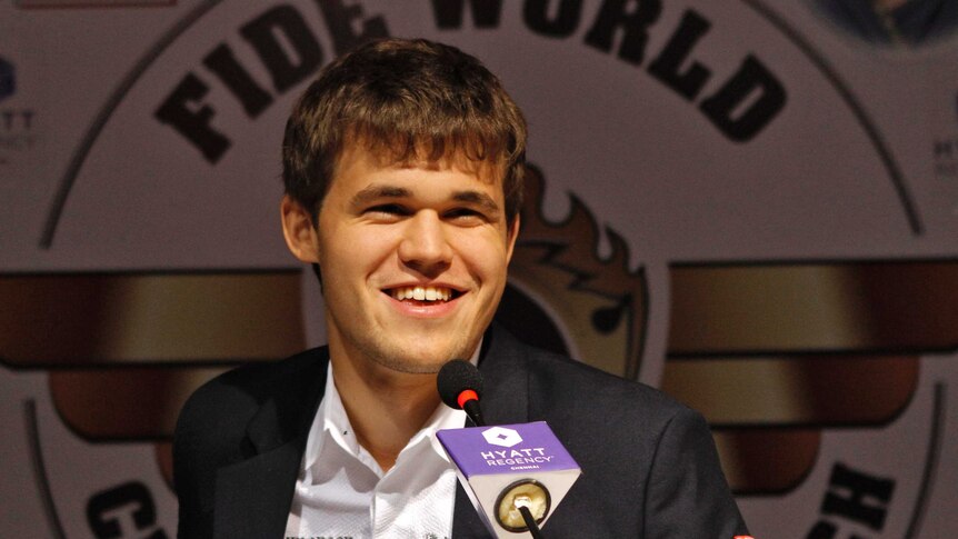 Norway's Magnus Carlsen smiles as he speaks with the media after winning the FIDE World Chess Championship