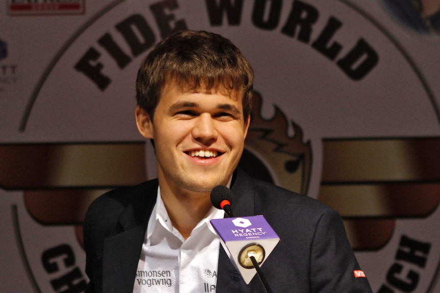 Norway's Magnus Carlsen smiles as he speaks with the media after winning the FIDE World Chess Championship