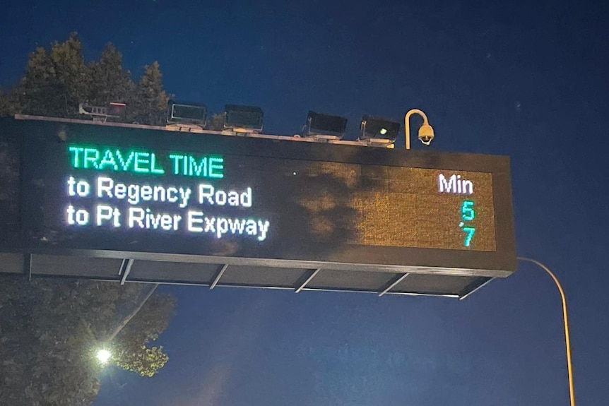 LED road sign with destinations and time to arrive with a camera installed above