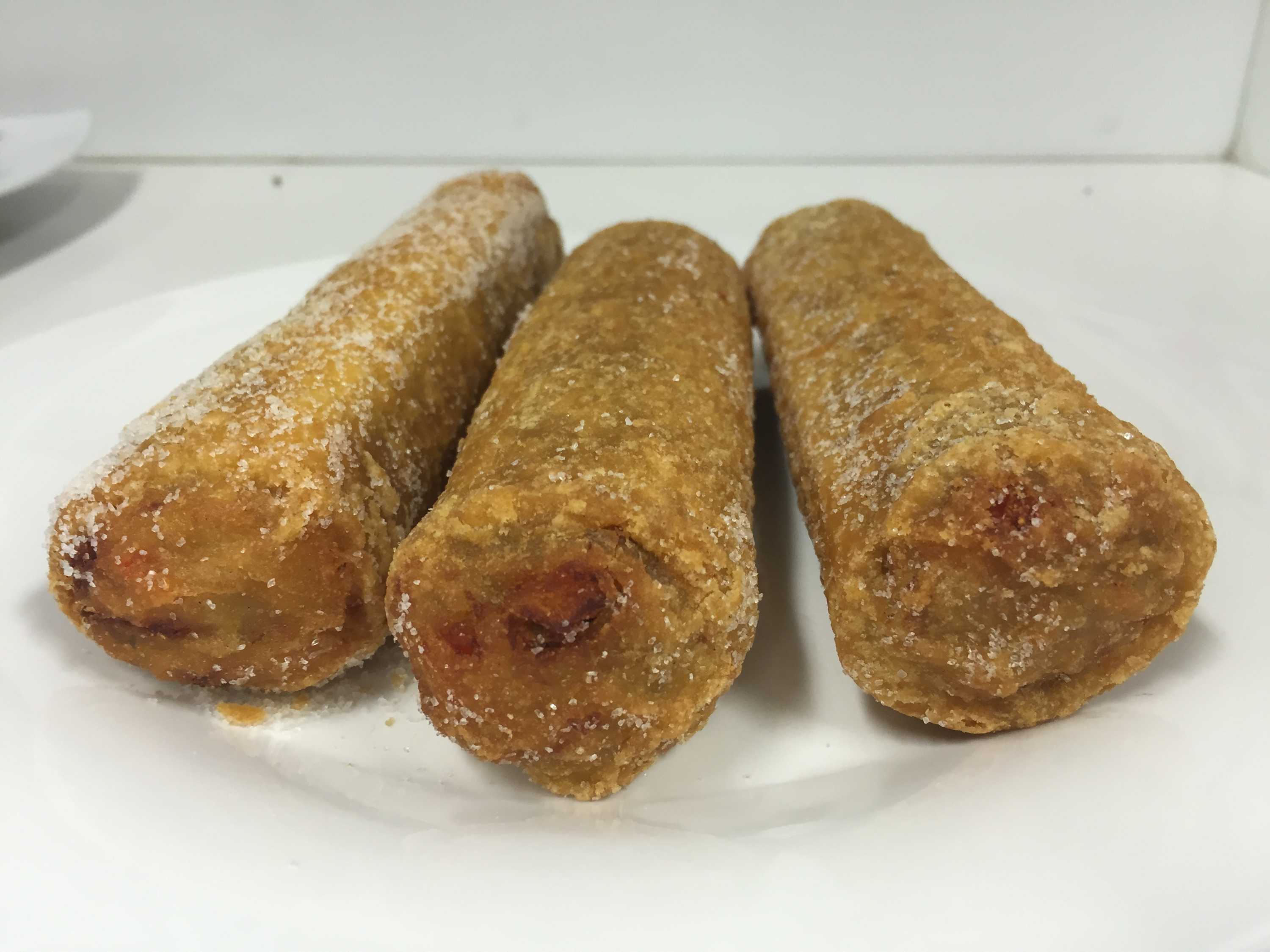 Three Chiko Rolls on a plate