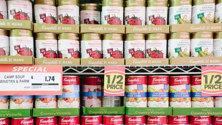 A shelf full of Campbell's tin soup.