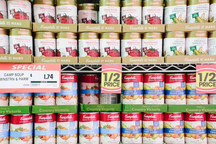 A shelf full of Campbell's tin soup.