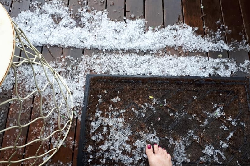 Small hail on the verandah.