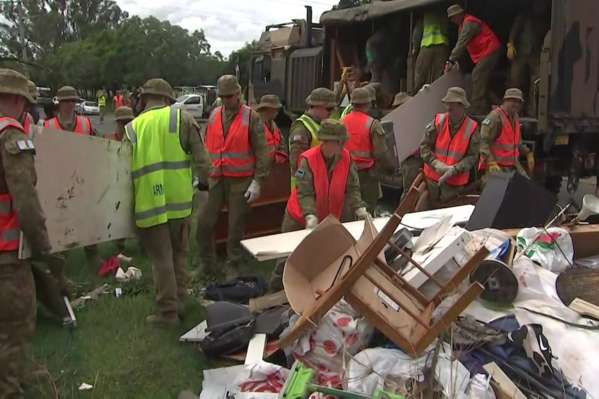 Soldiers helping with flood clean-up in Brisbane