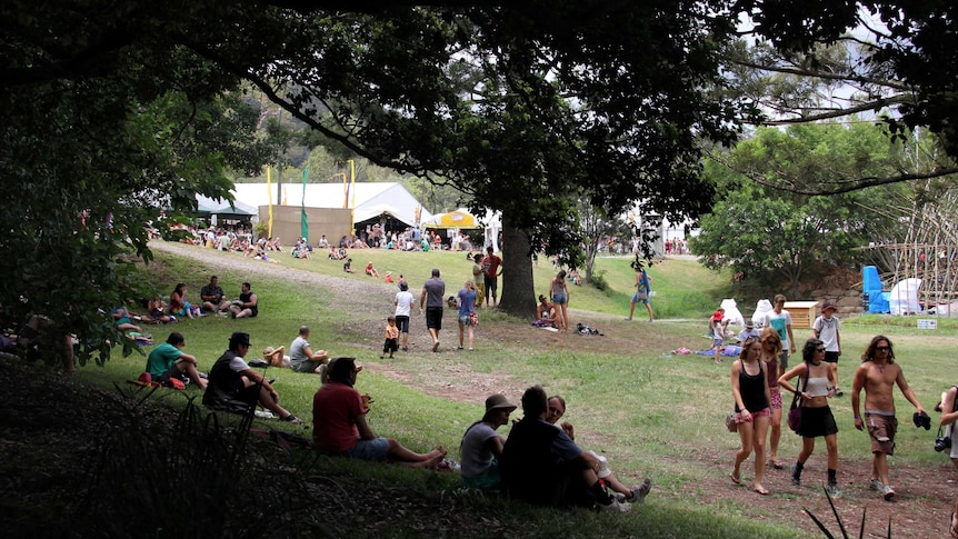 Crowds relax under the trees at the Woodford Folk Festival.