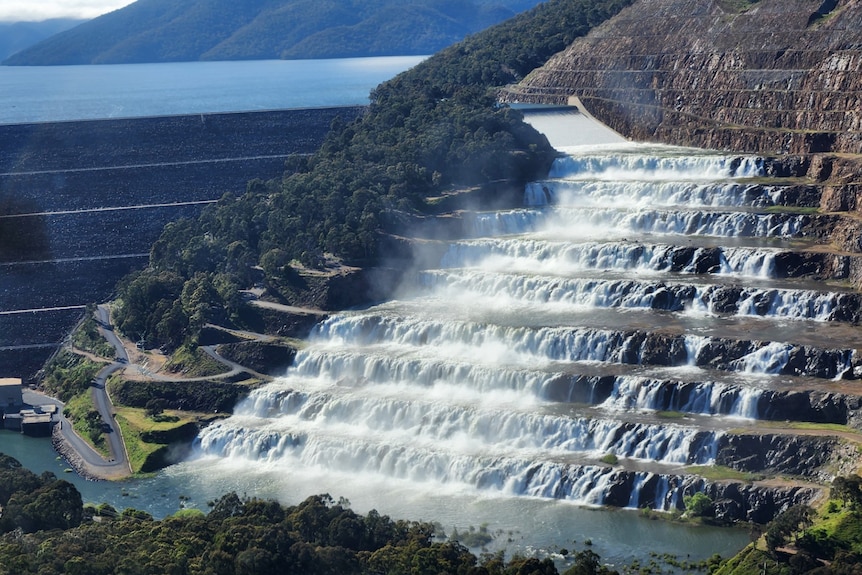 Water cascading down a spillway out of a dam 