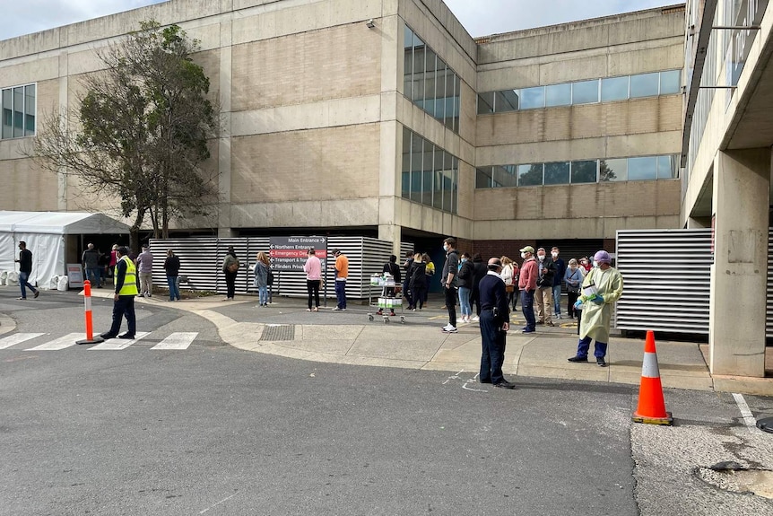 People lining up outside a hospital