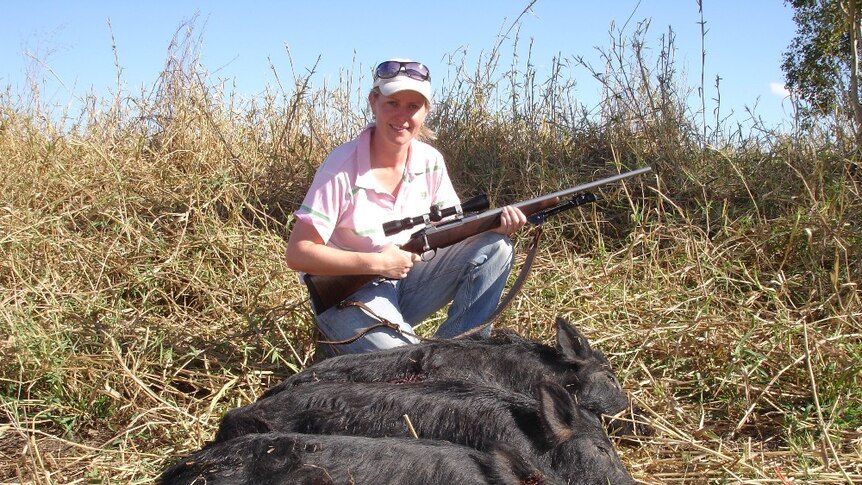 A lady hunter with wild pigs shot on hunting trip