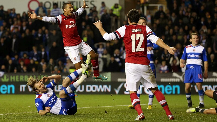 Theo Walcott celebrates Arsenal's sixth goal after the Gunners came back from four goals down.
