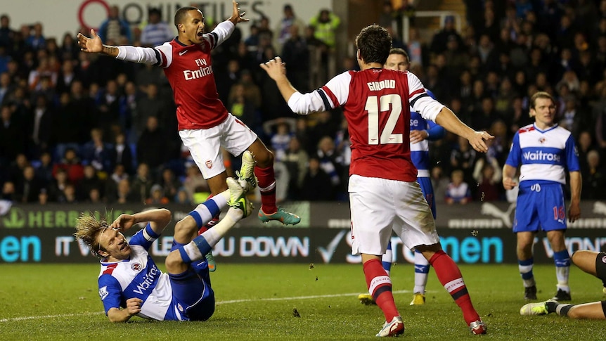 Theo Walcott celebrates Arsenal's sixth goal after the Gunners came back from four goals down.