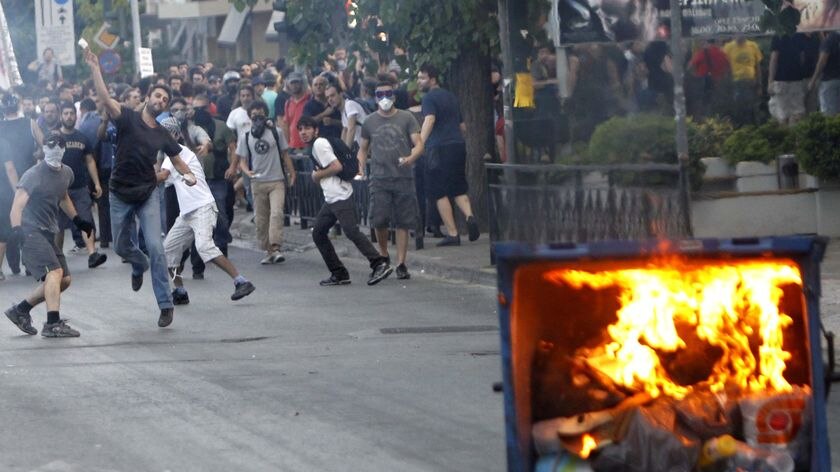 Greek clashes: protesters throw stones at police near the Israeli embassy in Athens