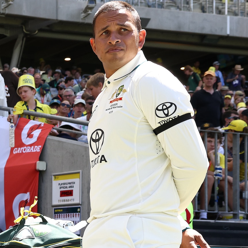 Usman Khawaja wearing a black armband before day one in the first Test against Pakistan in Perth.